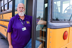 QCUSD school bus driver outside of bus