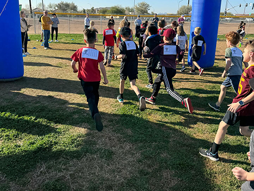 Students outside running during the Aviator Dash
