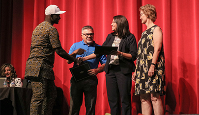 Male graduate receiving GED