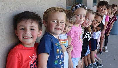 Kindergarten students lined up outside