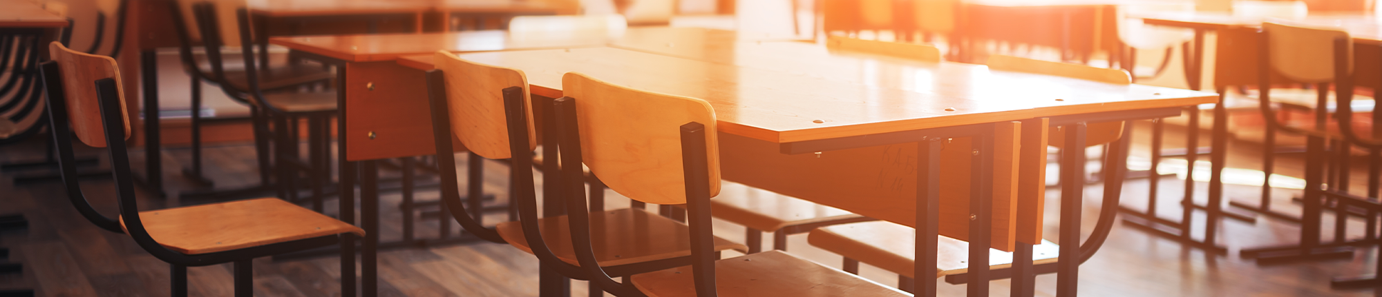 group of empty desks and chairs