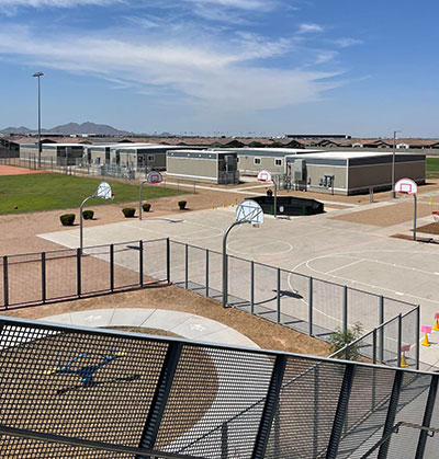 Portable classrooms outside next to basketball courts