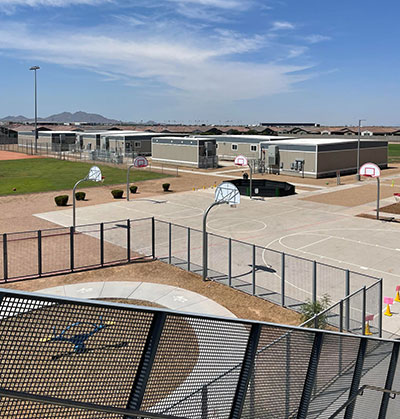 Portable classrooms outside next to basketball courts