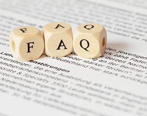 faq letter blocks sitting on a piece of typed paper