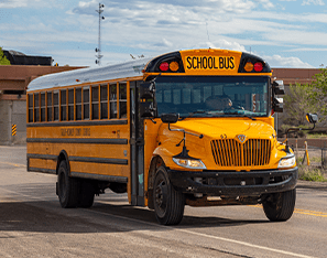 yellow school bus on the road