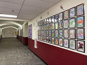Student drawings displayed in the hallway