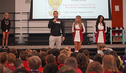 Arizona Cardinal talking to students