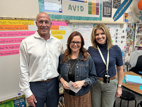 Superintendent Dr. Perry Berry pictured with award of excellence nominee Tiffany Cooney and Desert Mountain Elementary principal Erin Pillsbury