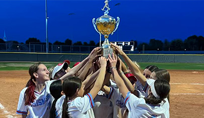 team on the field holding up the trophy together