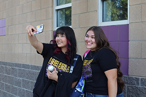 Two teenage girls taking a selfie