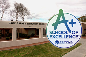 Front of Jack Barnes Elementary school with A+ School of Excellence award graphic