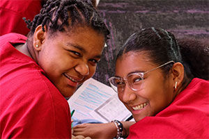 Two students smiling