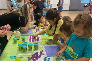 Students playing with play-dough to learn words