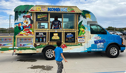 Student looking at Kona Ice truck