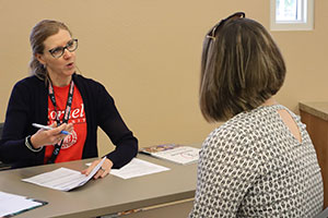 Woman speaking to a job counselor at the job fair