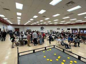 people in gym by the competition stage