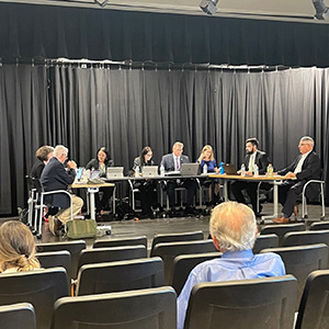 Members of School Facilities Oversight Board meeting on stage