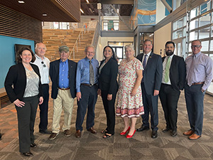 Members of the School Facilities Oversight Board standing in lobby