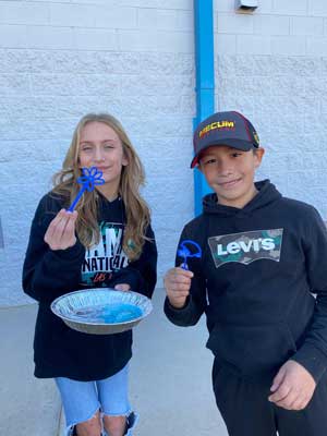 Students playing with bubble makers