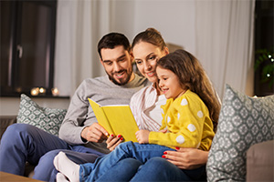 Family reading a book together