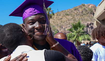 Graduating student getting a hug