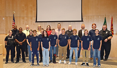 Youth Academy program members on a stage