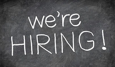 We're hiring written on a chalkboard