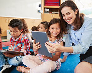 Teacher showing student something on a tablet