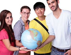 Four foreign exchange students holding a globe