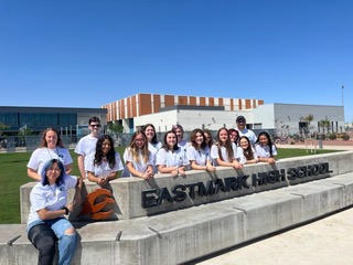 FBLA students in front of Eastmark High School sign